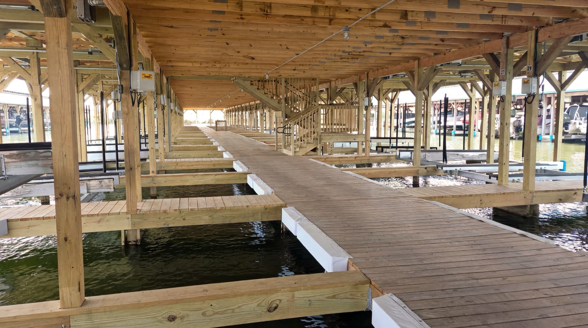 Covered slip walkway and boat lifts at Lake Anna Yacht Club in Mineral, Virginia